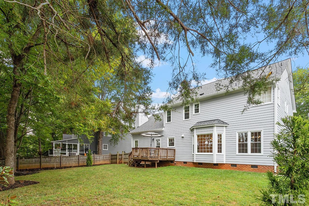 403 Danton Drive Cary, NC 27518 - Photo 37 of 38 a front view of a house with a garden and trees