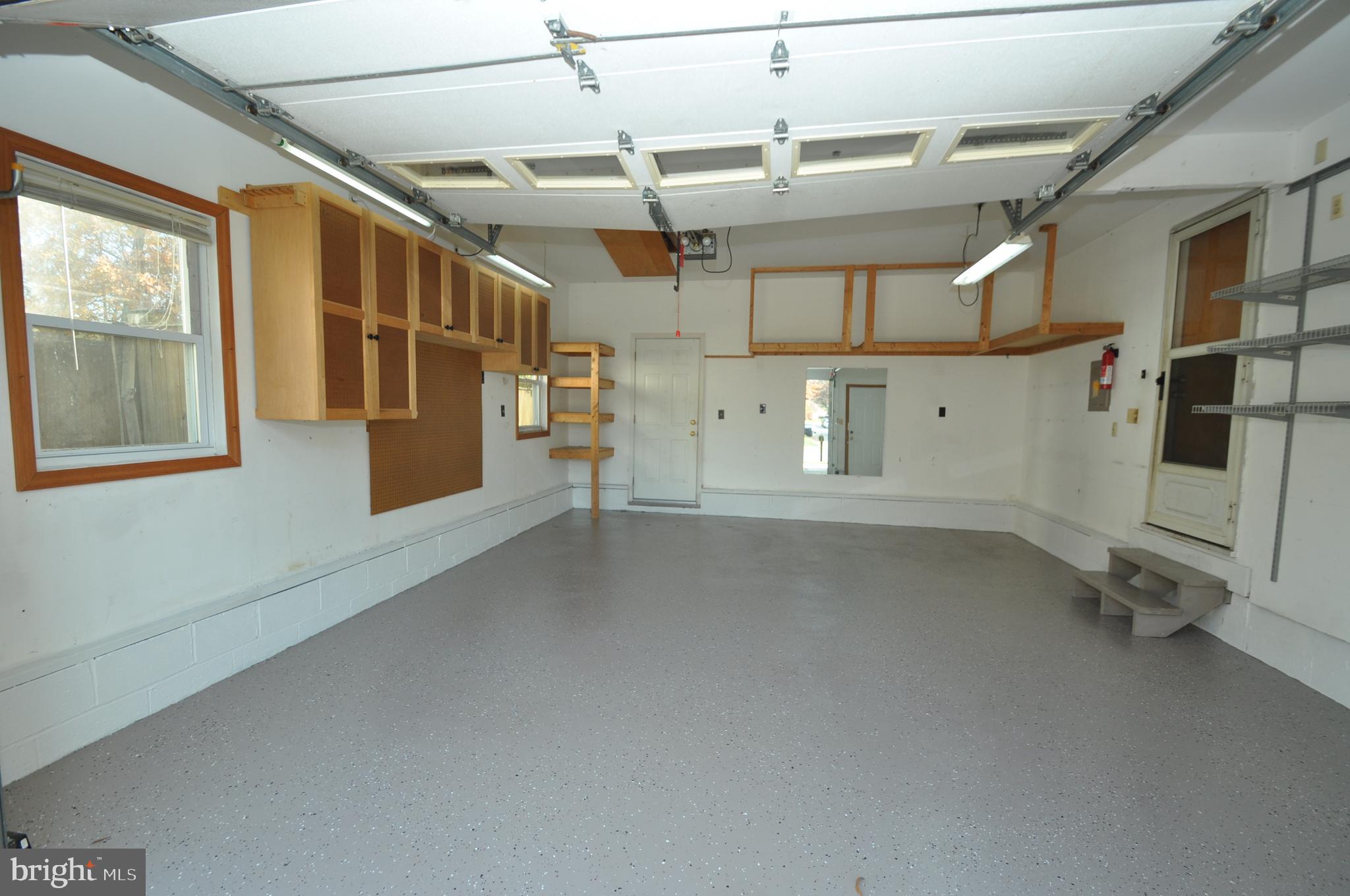 16113 Jerald Road Laurel, MD 20707 - Photo 19 of 22 GARAGE WITH LOTS OF CABINETS & SHELVING