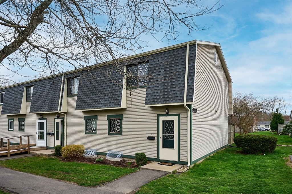 170 East Hadley Road, Unit 124 Amherst, MA 01002 - Photo 1 of 20 a front view of a house with a yard
