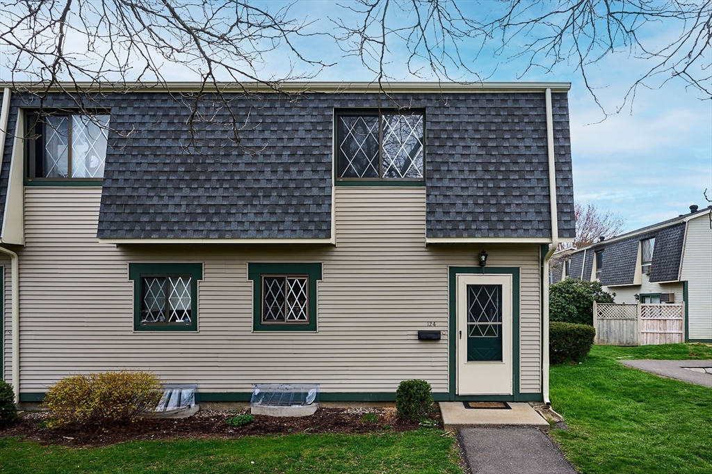 170 East Hadley Road, Unit 124 Amherst, MA 01002 - Photo 2 of 20 a front view of a house with garden