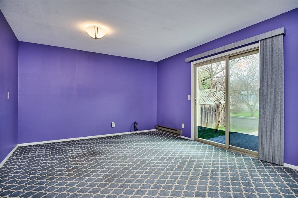 170 East Hadley Road, Unit 124 Amherst, MA 01002 - Photo 5 of 20 a view of empty room with floor to ceiling window