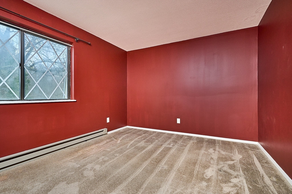 170 East Hadley Road, Unit 124 Amherst, MA 01002 - Photo 10 of 20 a view of empty room with window