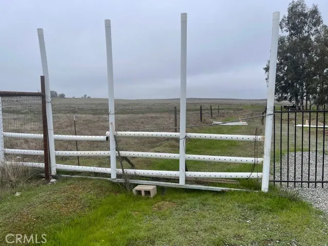 a view of an empty room with a floor to ceiling window