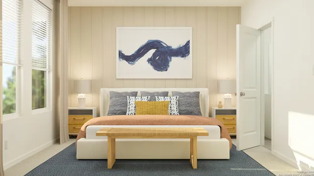 a bedroom with a bed and a painting on the wall