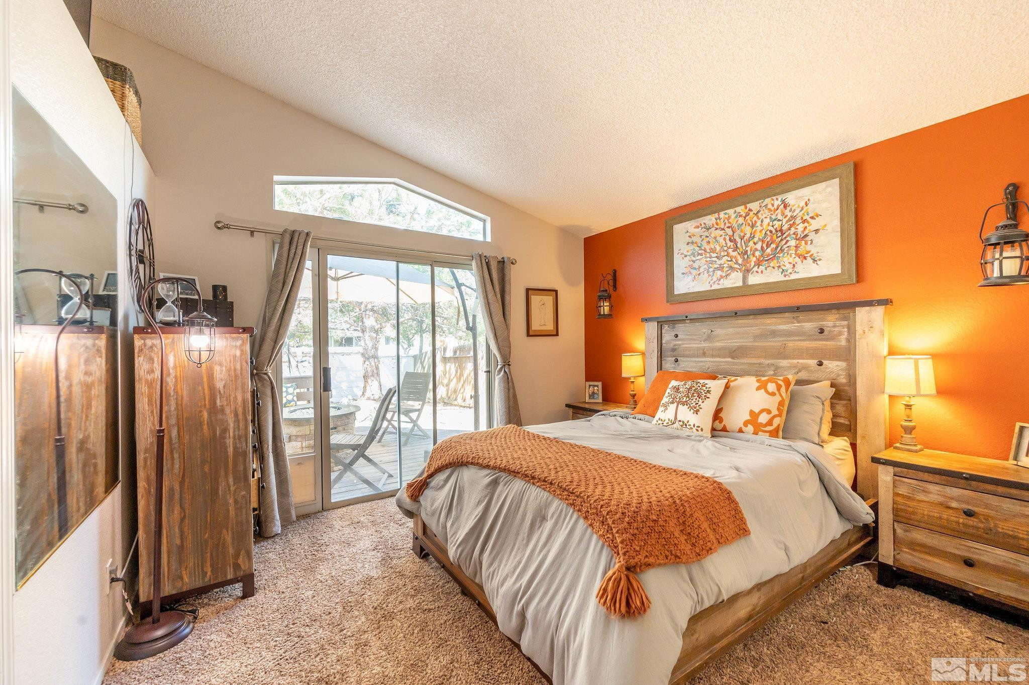 7513 Devonshire Lane Reno, NV 89511 - Photo 11 of 16 a bedroom with a bed and a large window with outer view