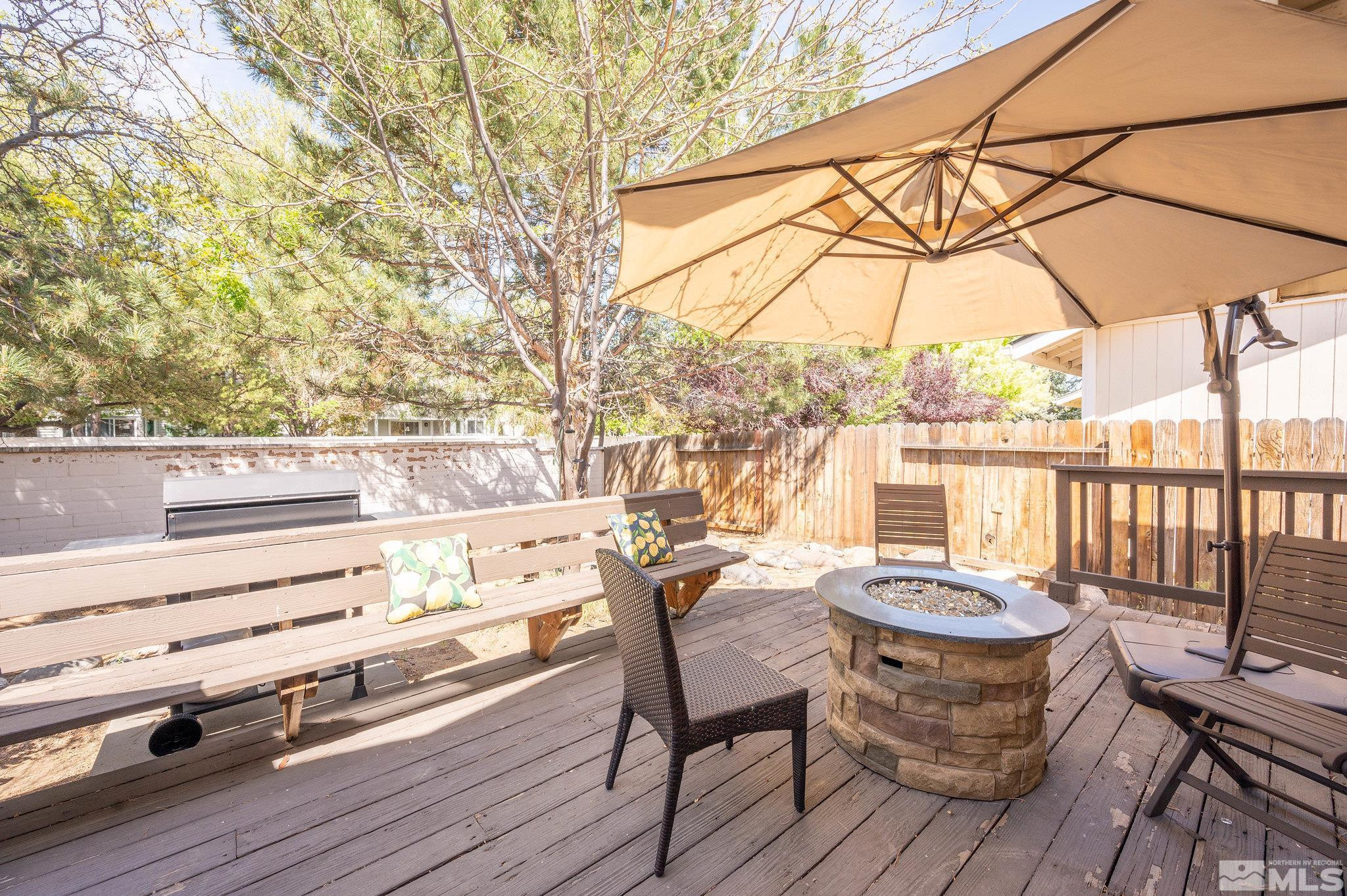 7513 Devonshire Lane Reno, NV 89511 - Photo 14 of 16 a view of balcony with wooden floor and outdoor seating