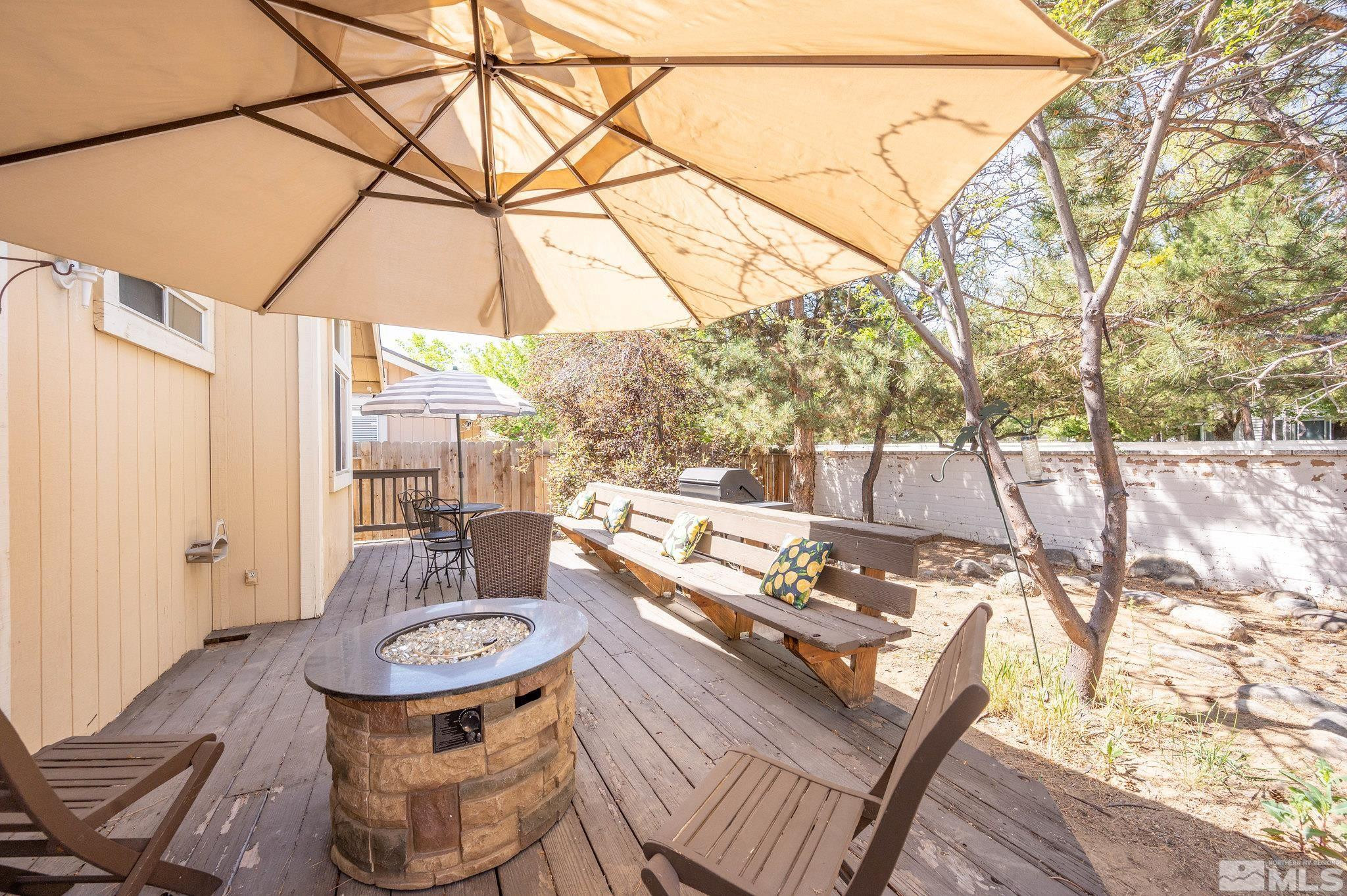 7513 Devonshire Lane Reno, NV 89511 - Photo 16 of 16 a backyard of a house with table and chairs