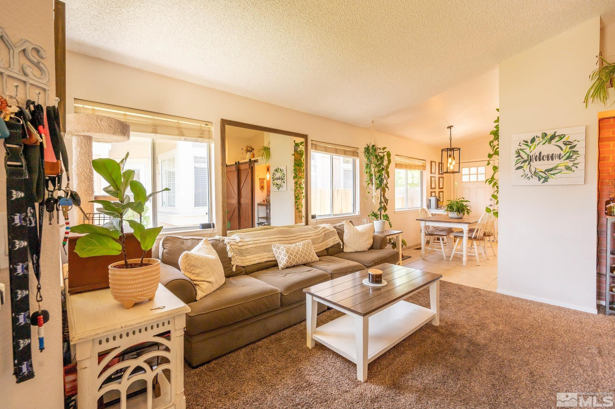 7513 Devonshire Lane Reno, NV 89511 - Photo 3 of 16 a living room with furniture and a large window