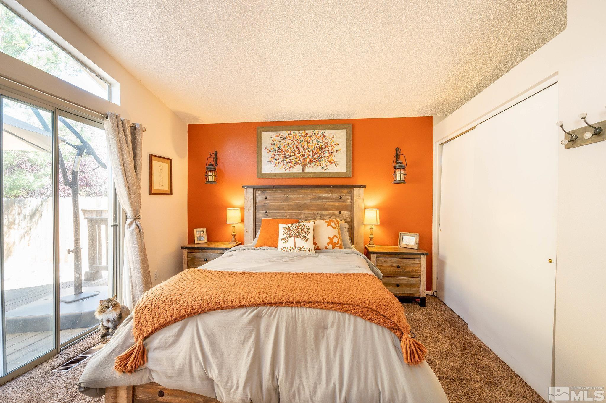 7513 Devonshire Lane Reno, NV 89511 - Photo 10 of 16 a bed sitting in a bedroom next to a window