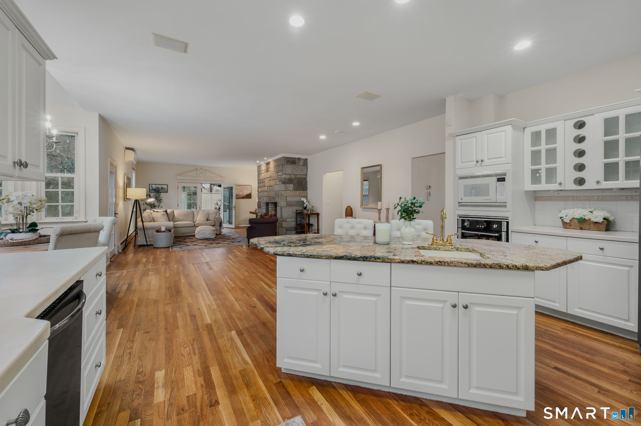 14 Riverside Drive Waterford, CT 06385 - Photo 12 of 40 a kitchen with granite countertop a sink cabinets and wooden floor