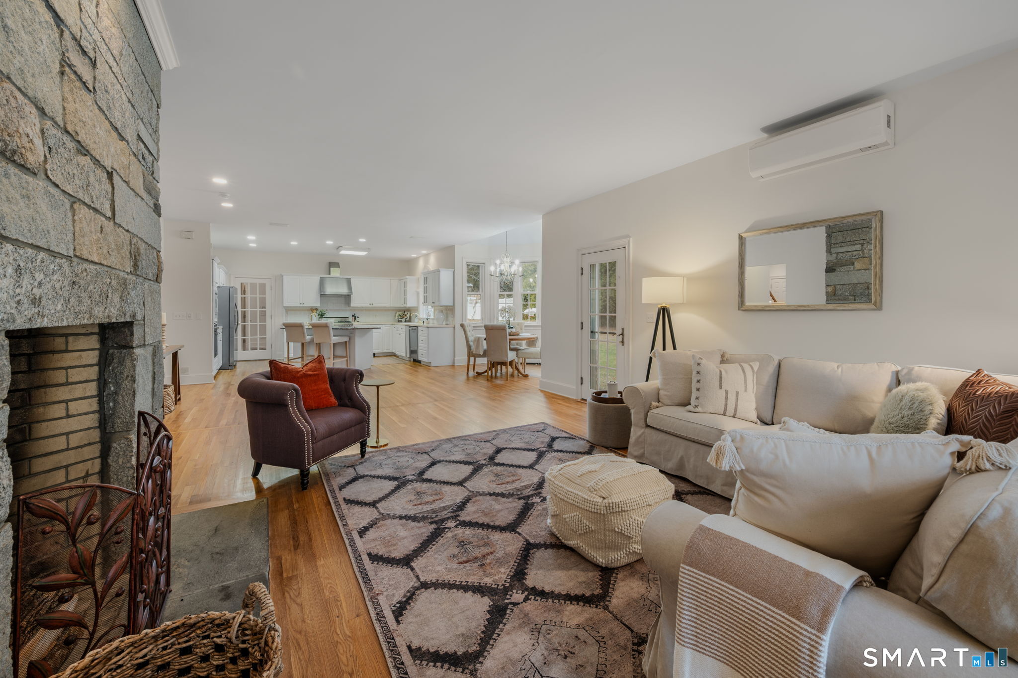 14 Riverside Drive Waterford, CT 06385 - Photo 17 of 40 a living room with furniture and a fireplace