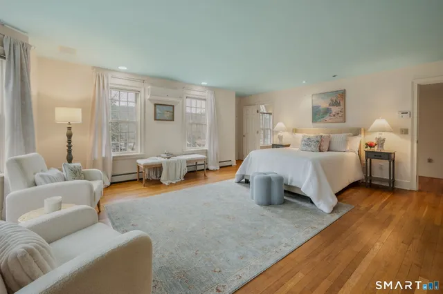 a bedroom with furniture and a couch