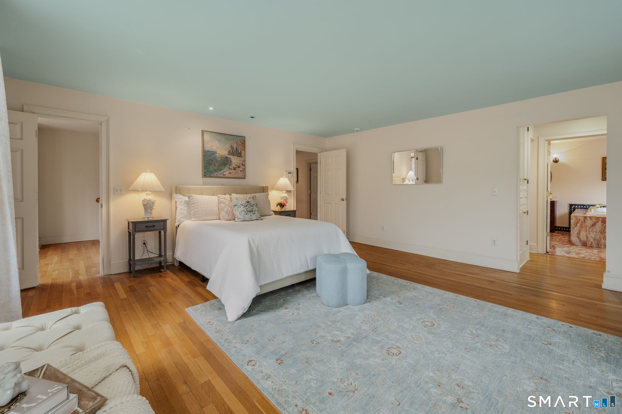 14 Riverside Drive Waterford, CT 06385 - Photo 27 of 40 a bedroom with a bed and wooden floor