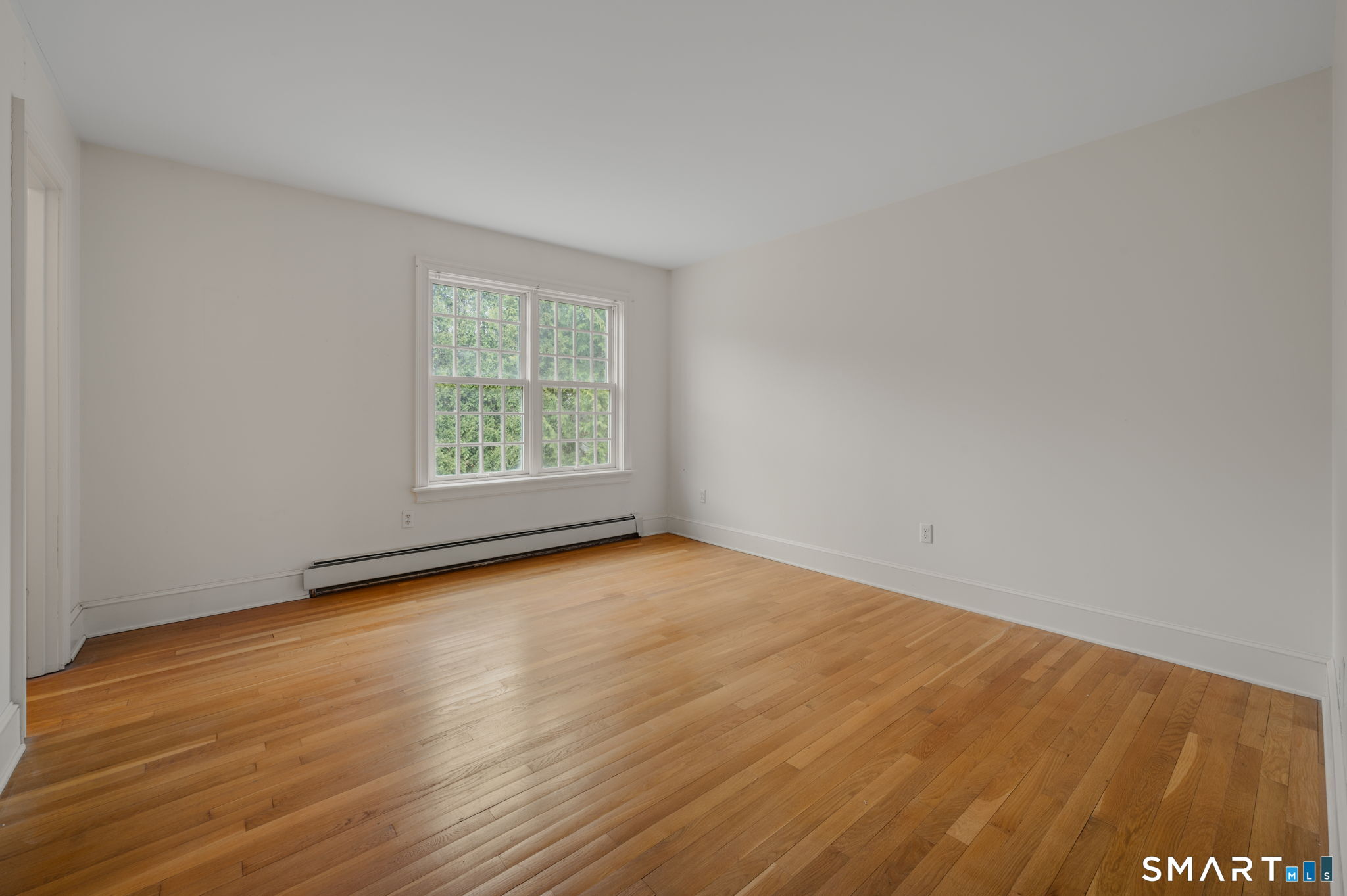 14 Riverside Drive Waterford, CT 06385 - Photo 32 of 40 an empty room with wooden floor and windows