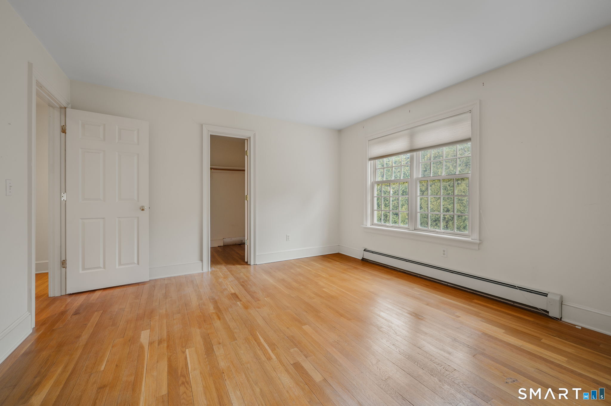 14 Riverside Drive Waterford, CT 06385 - Photo 33 of 40 an empty room with wooden floor and windows