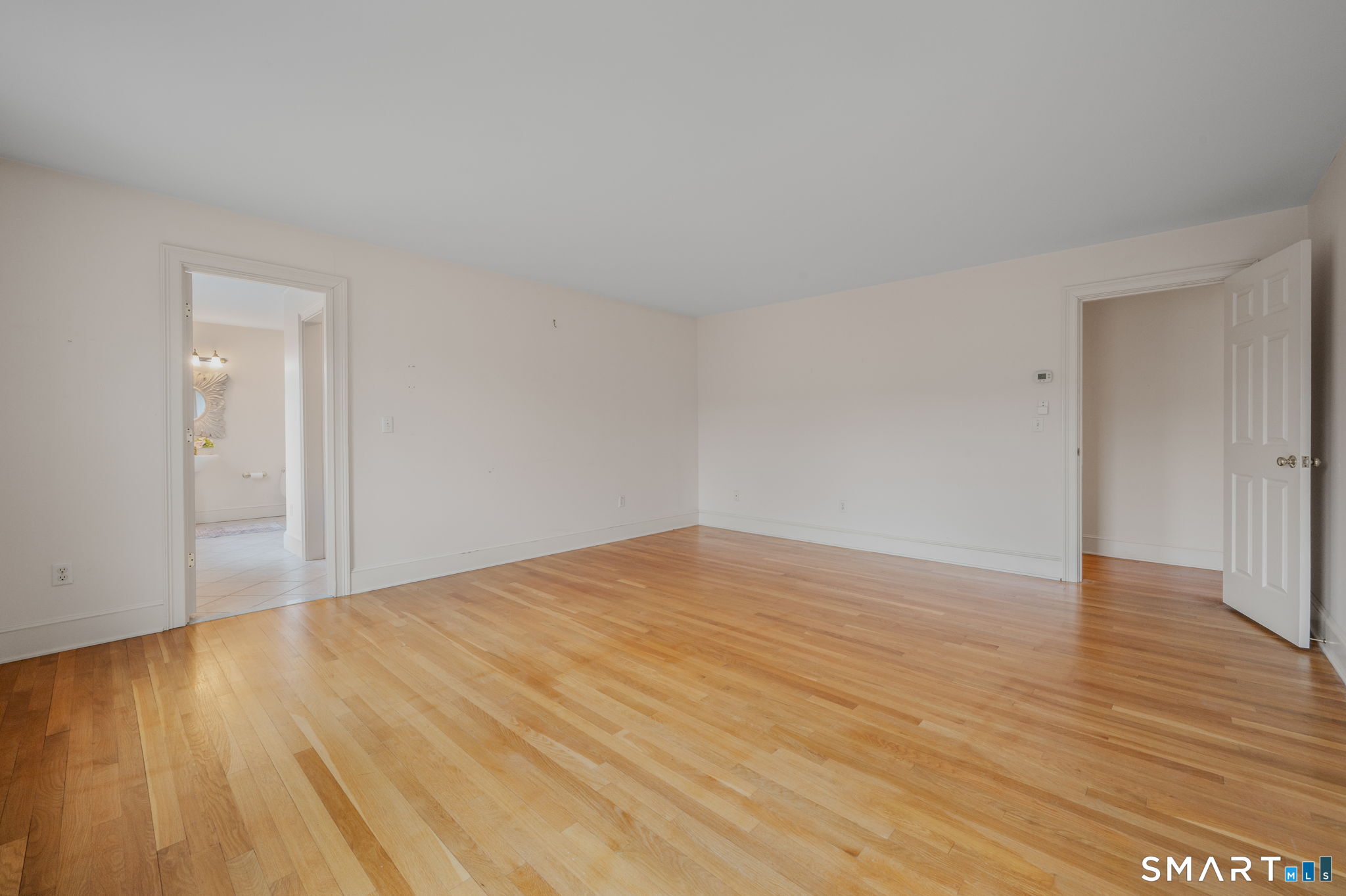 14 Riverside Drive Waterford, CT 06385 - Photo 34 of 40 a view of an empty room and wooden floor