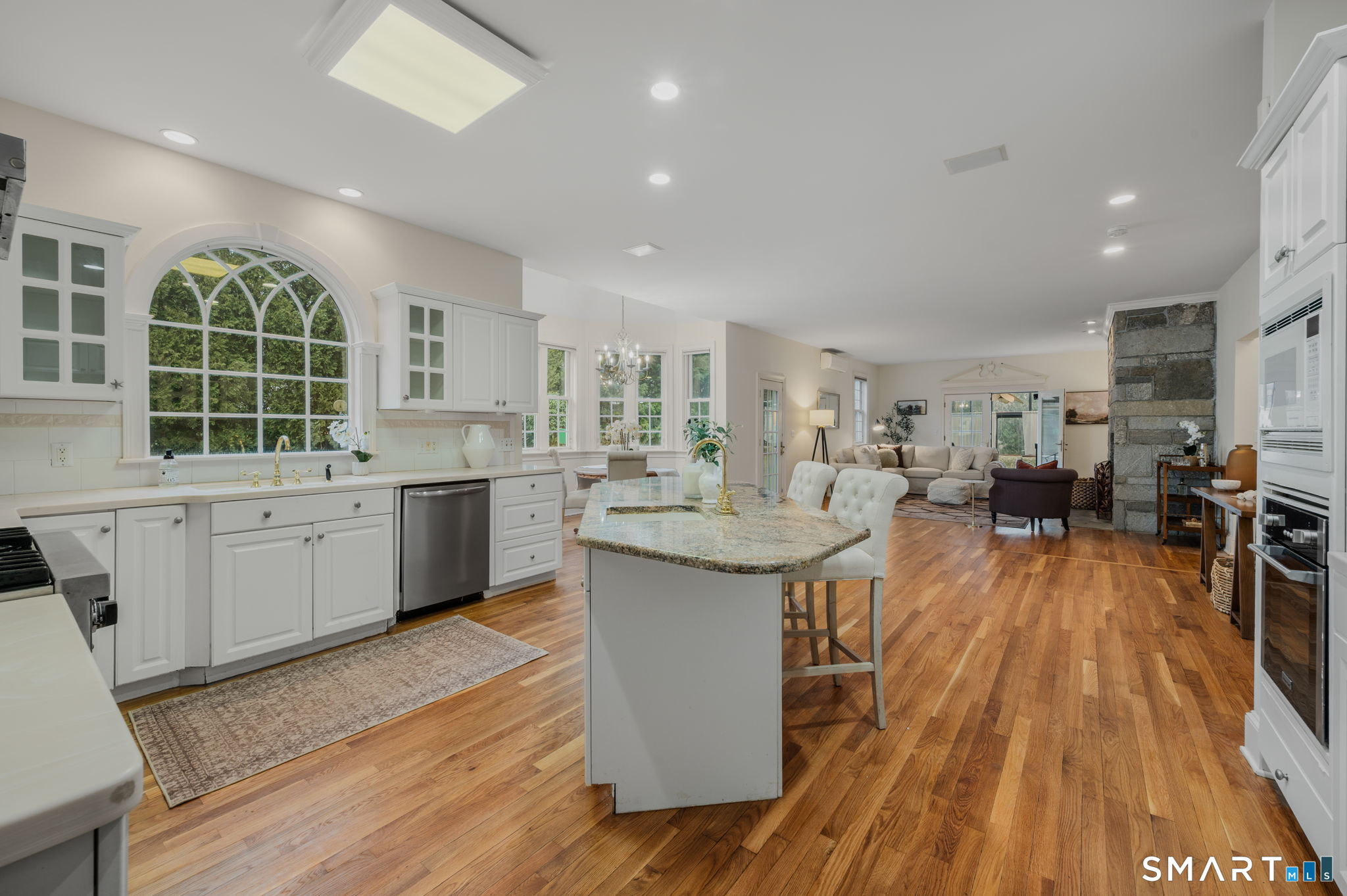 14 Riverside Drive Waterford, CT 06385 - Photo 10 of 40 a large kitchen with stainless steel appliances a lot of counter space and a wooden floors