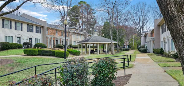 a kitchen with granite countertop a refrigerator and a sink