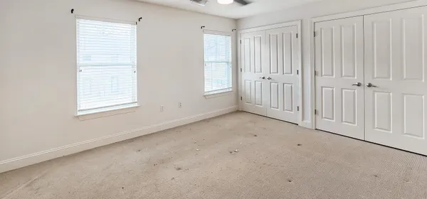 a bathroom with a shower curtain and a toilet