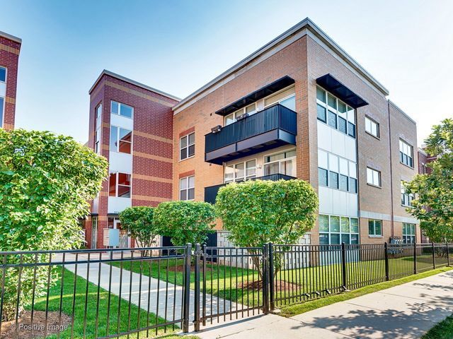 2231 West Maypole Avenue, Unit 201 Chicago, IL 60612 - Photo 1 of 10 a front view of a house with a garden