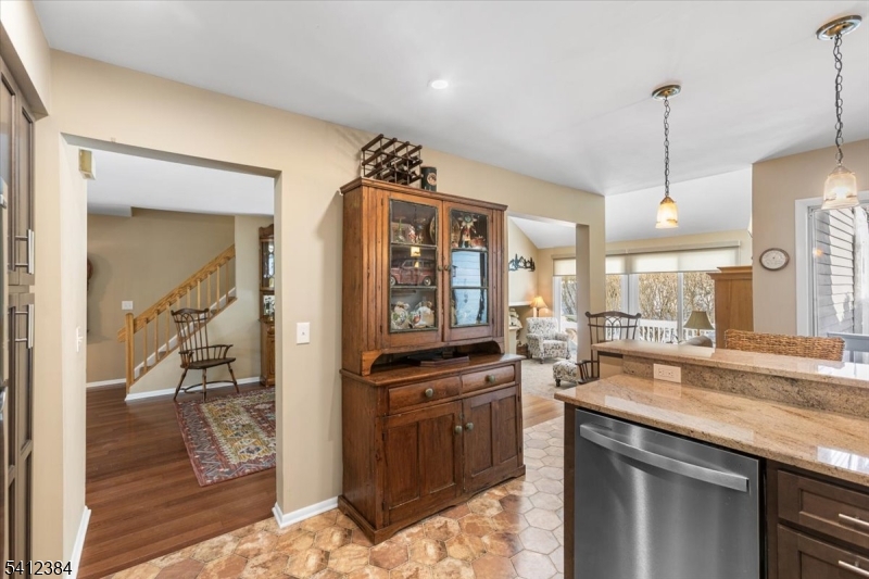 10 Gristmill Sparta, NJ 07871 - Photo 11 of 35 a kitchen with granite countertop a stove a sink and a refrigerator
