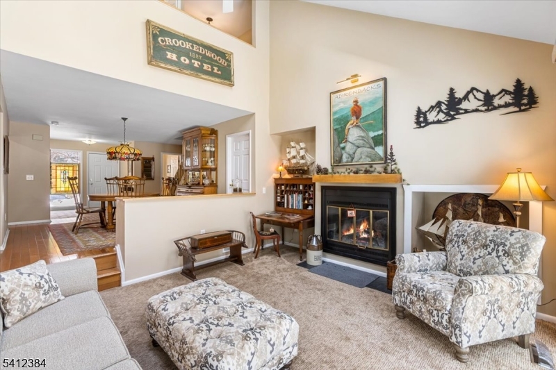 10 Gristmill Sparta, NJ 07871 - Photo 16 of 35 a living room with furniture and a fireplace