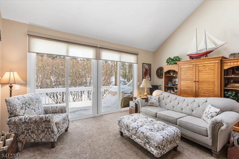 10 Gristmill Sparta, NJ 07871 - Photo 17 of 35 a living room with furniture and a large window