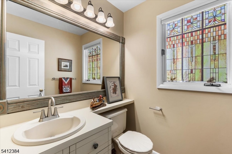 10 Gristmill Sparta, NJ 07871 - Photo 21 of 35 a bathroom with a sink and a mirror