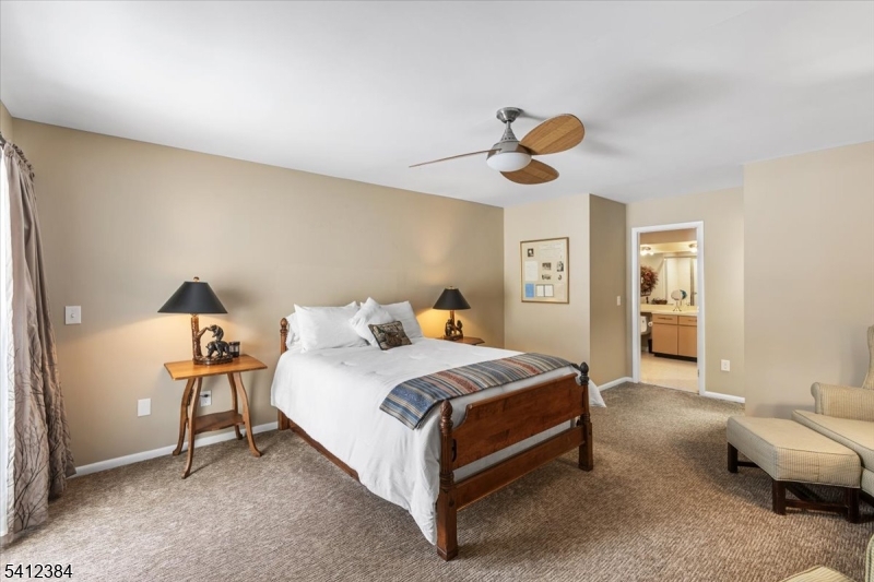 10 Gristmill Sparta, NJ 07871 - Photo 23 of 35 a bedroom with a bed and window