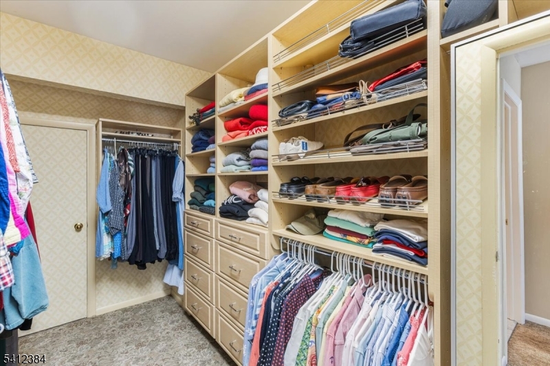 10 Gristmill Sparta, NJ 07871 - Photo 27 of 35 a view of walk in closet with clothes and shoes