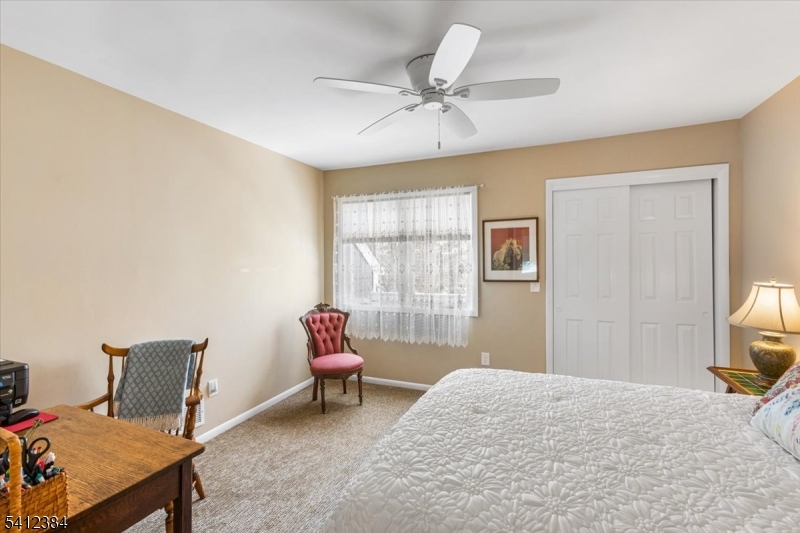 10 Gristmill Sparta, NJ 07871 - Photo 28 of 35 a bedroom with furniture and a window