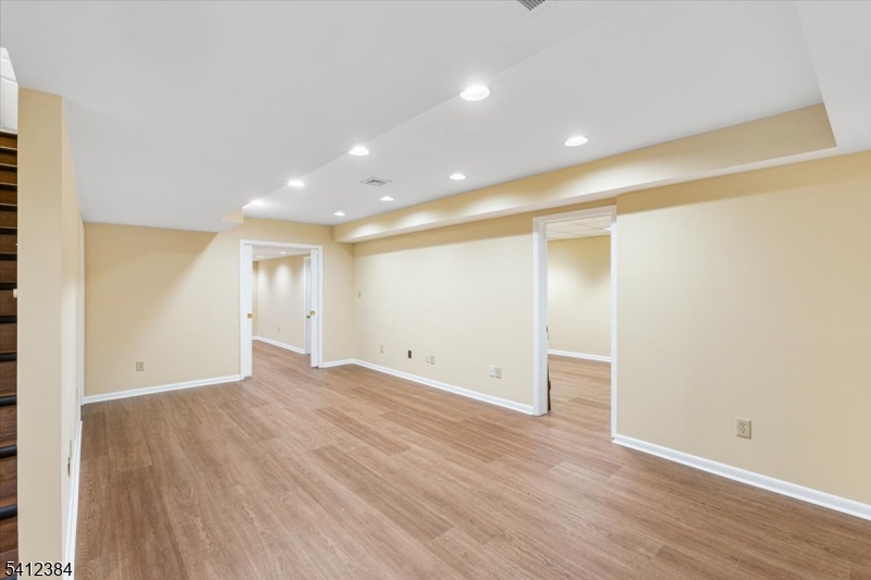 10 Gristmill Sparta, NJ 07871 - Photo 31 of 35 an empty room with wooden floor and windows