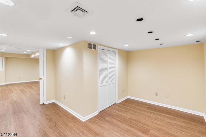 10 Gristmill Sparta, NJ 07871 - Photo 34 of 35 an empty room with wooden floor and windows