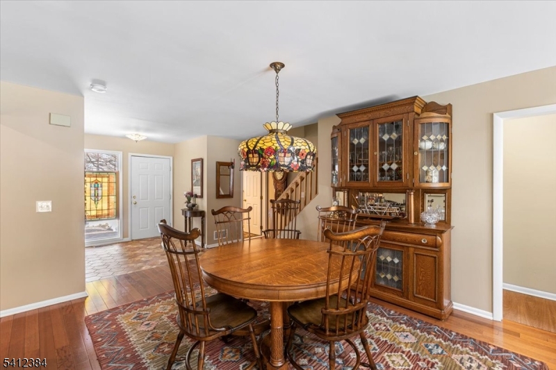 10 Gristmill Sparta, NJ 07871 - Photo 7 of 35 a dining room with furniture window and wooden floor