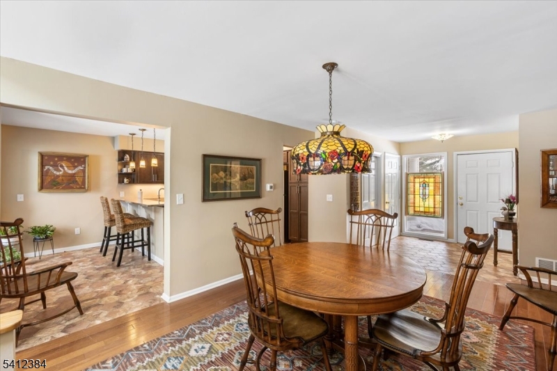 10 Gristmill Sparta, NJ 07871 - Photo 8 of 35 a dining room with furniture window and wooden floor