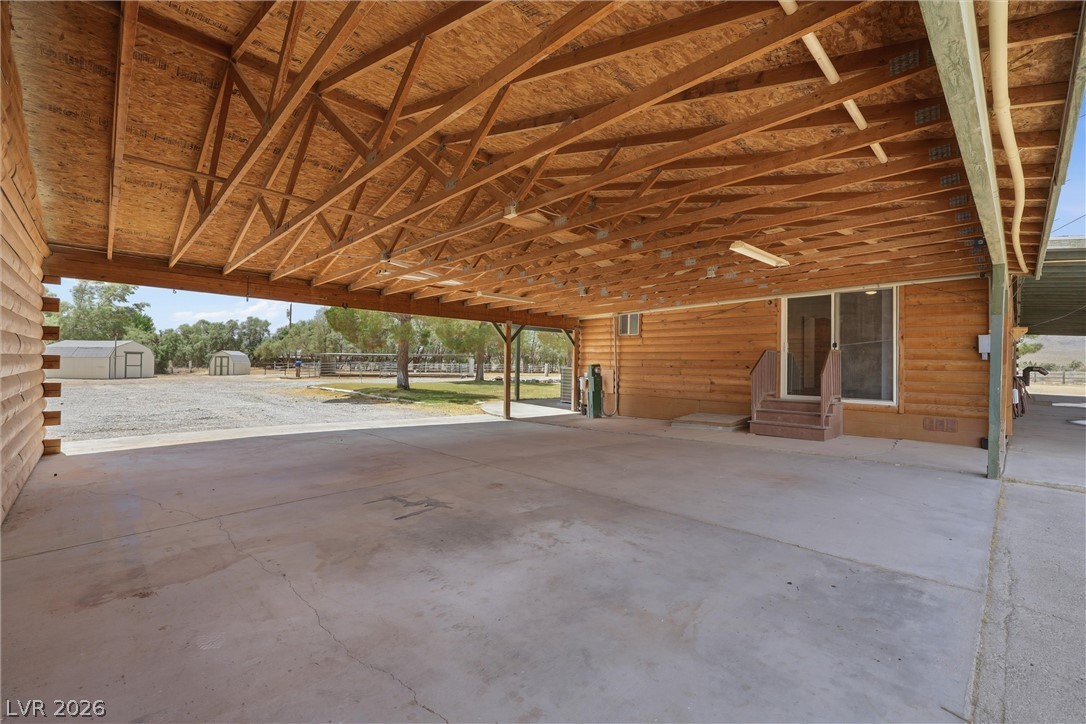 1531 West Harris Farm Road Pahrump, NV 89060 - Photo 9 of 37 A spacious covered patio provides ample room for relaxation and outdoor activities.
