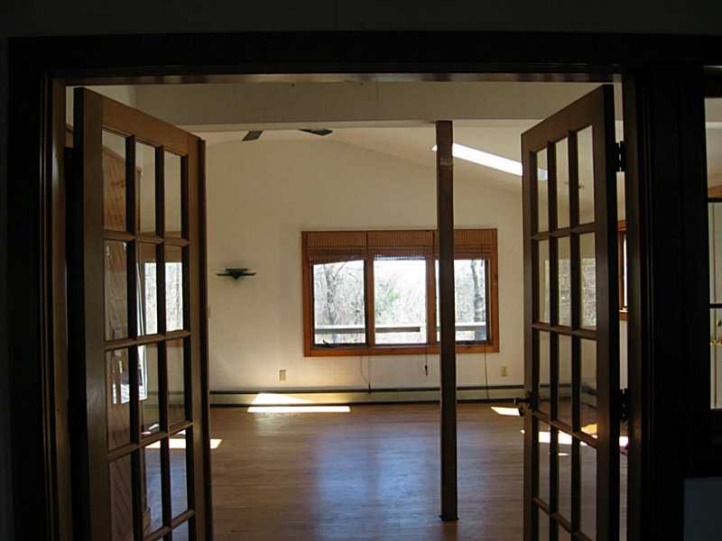 2140 Boston Neck Road North Kingstown, RI 02874 - Photo 11 of 11 Living Room. Double doors from LR to BR