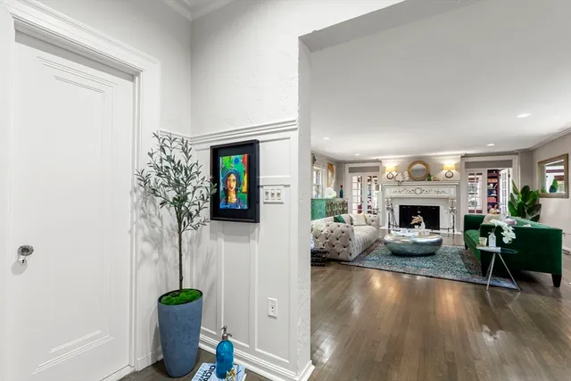a bedroom with a bed window and dresser