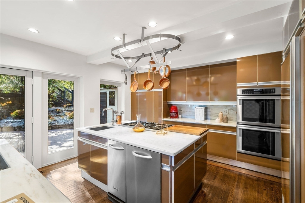 1125 West Roxbury Parkway Brookline, MA 02467 - Photo 16 of 42 a kitchen with stainless steel appliances a stove a sink and a refrigerator
