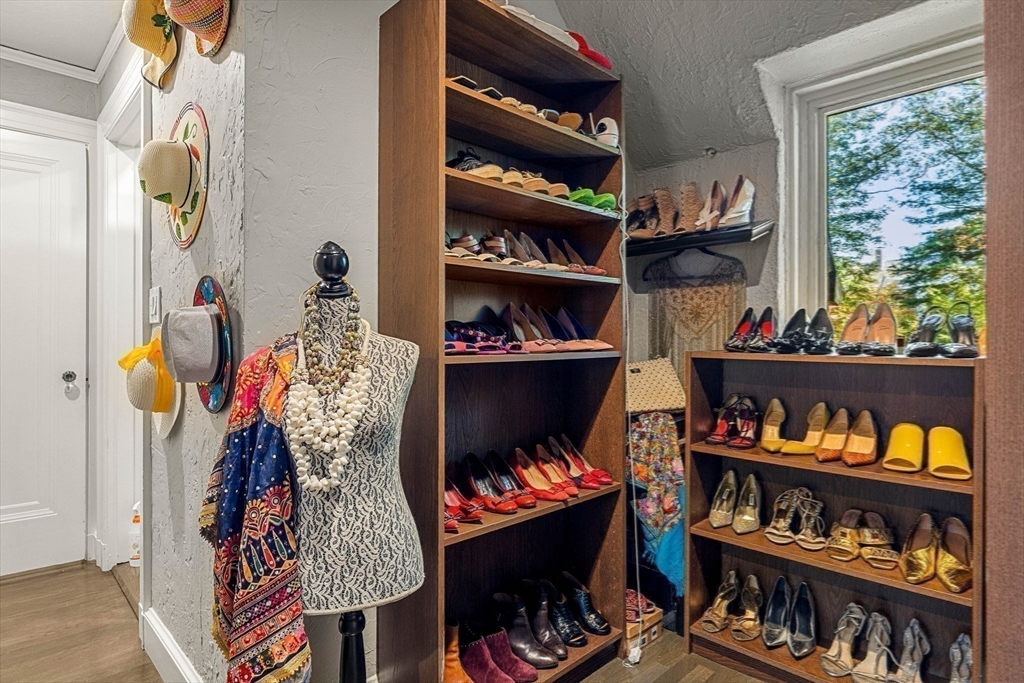 1125 West Roxbury Parkway Brookline, MA 02467 - Photo 28 of 42 a room with lots of different colored cloths