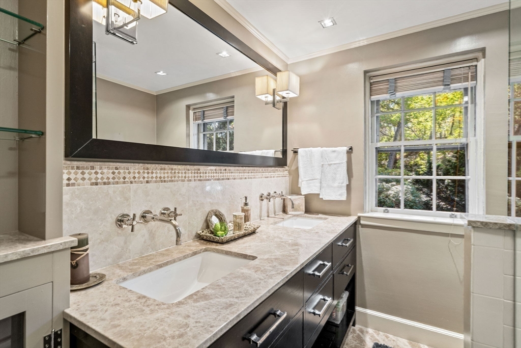 1125 West Roxbury Parkway Brookline, MA 02467 - Photo 32 of 42 a bathroom with a granite countertop sink and a mirror