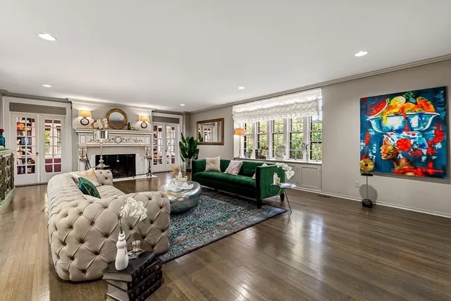 a spacious bedroom with a bed and a fireplace