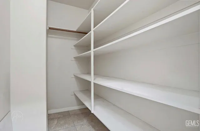 a view of an empty walk in closet