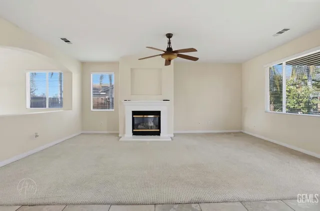 a view of empty room with fireplace