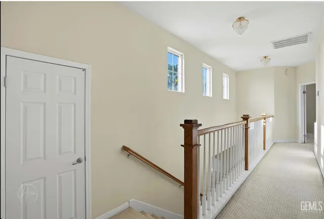 a view of a hallway with windows