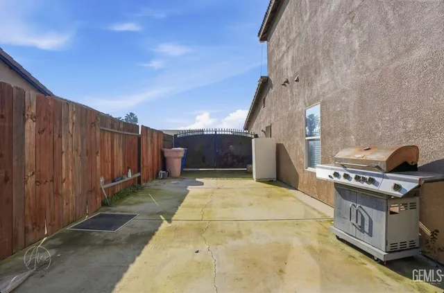 a backyard of a house with stainless steel appliances