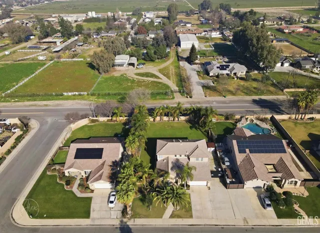 an aerial view of a house with a ocean view