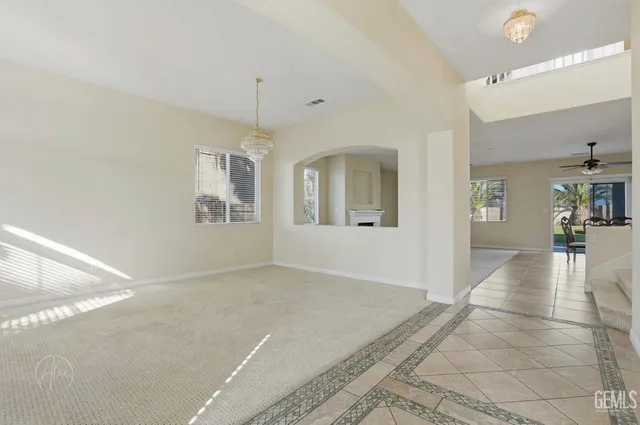 a view of livingroom with hardwood floor and a ceiling fan