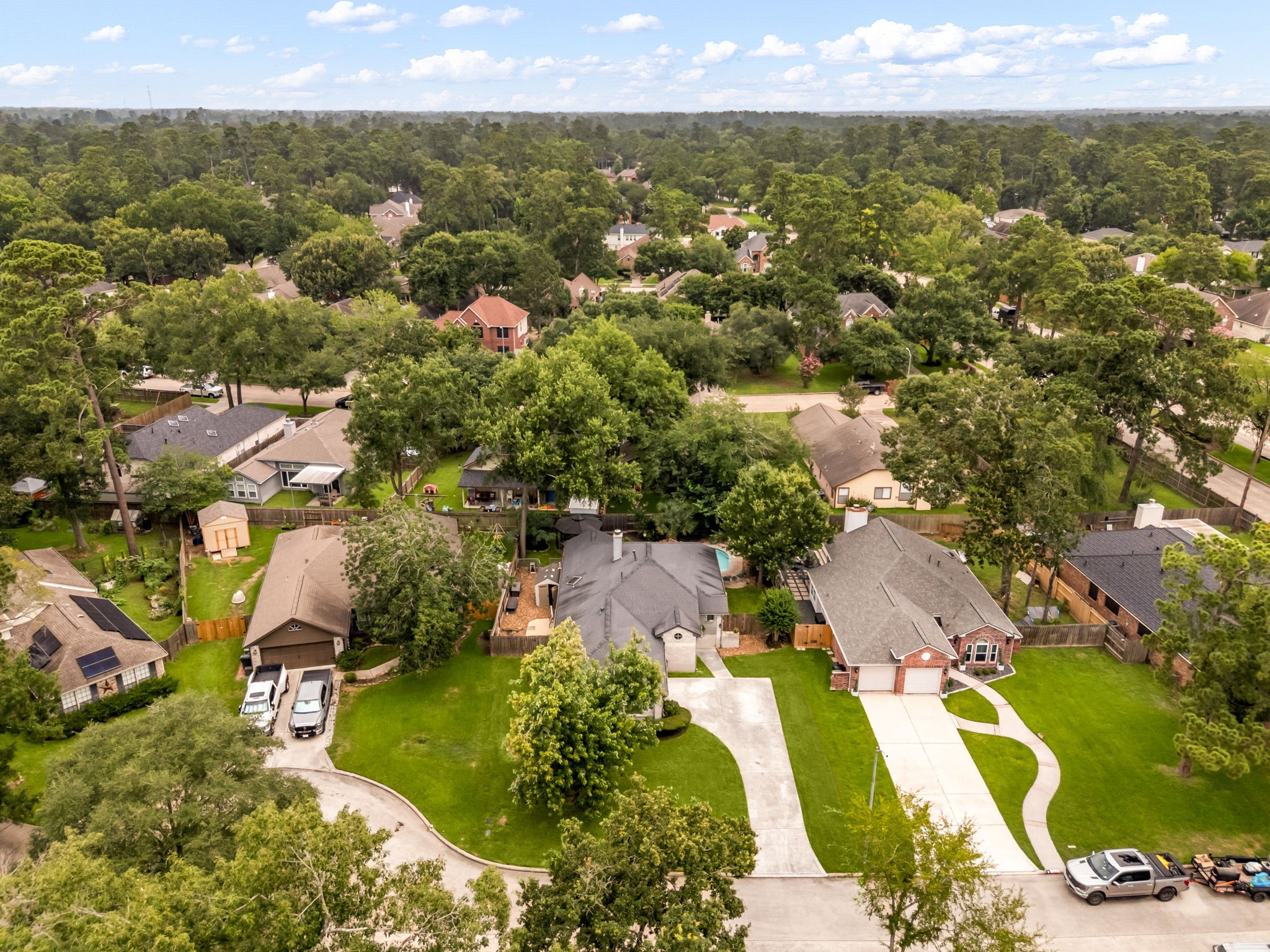 1915 Mercoal Drive Spring, TX 77386 - Photo 38 of 50 Bird’s-eye view highlighting the neighborhood’s mature trees and residential setting.