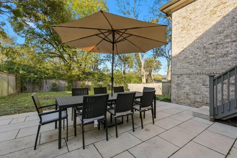 a backyard of a house with lots of green space